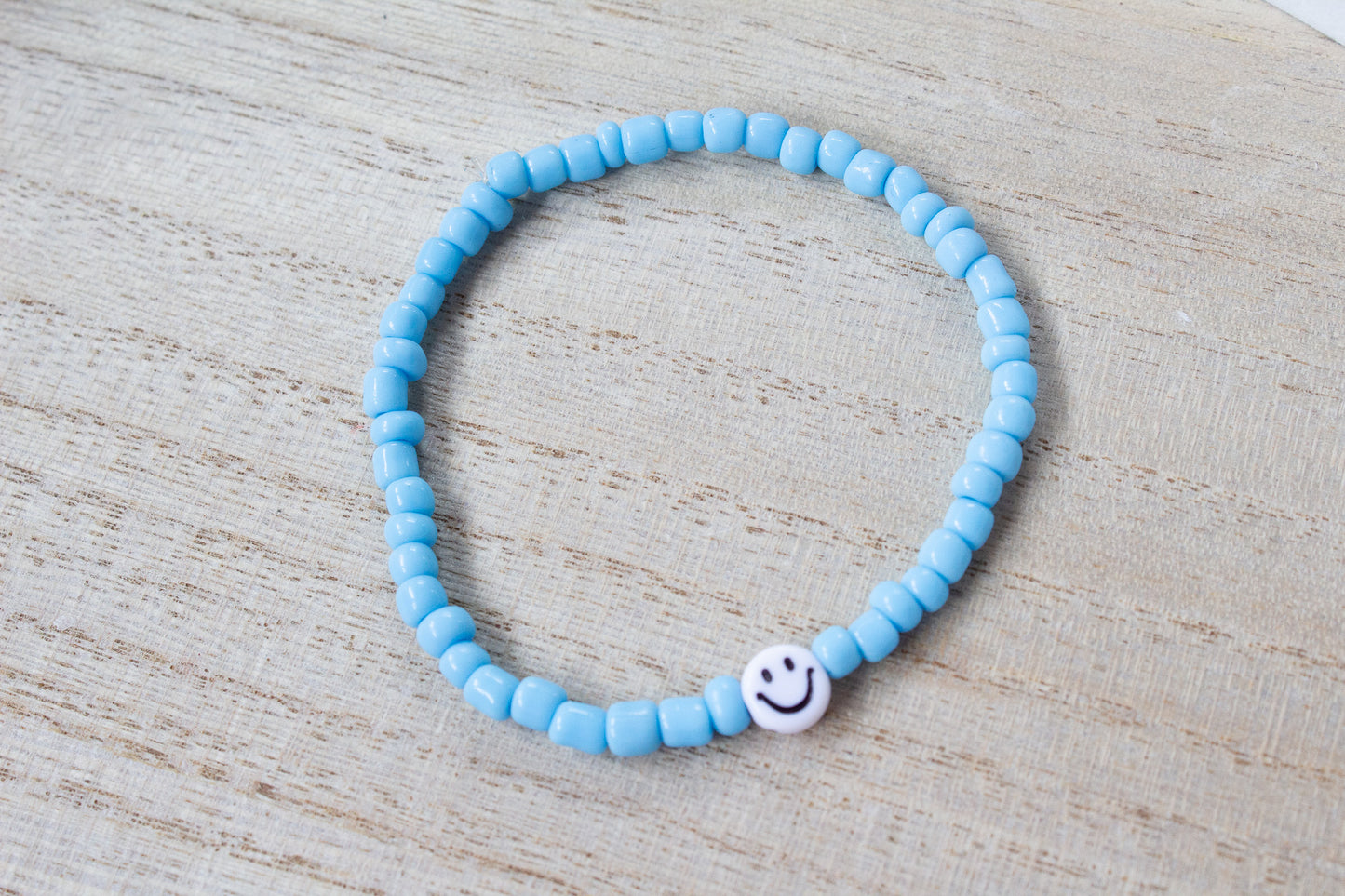 Perlenarmband türkis mit Smiley