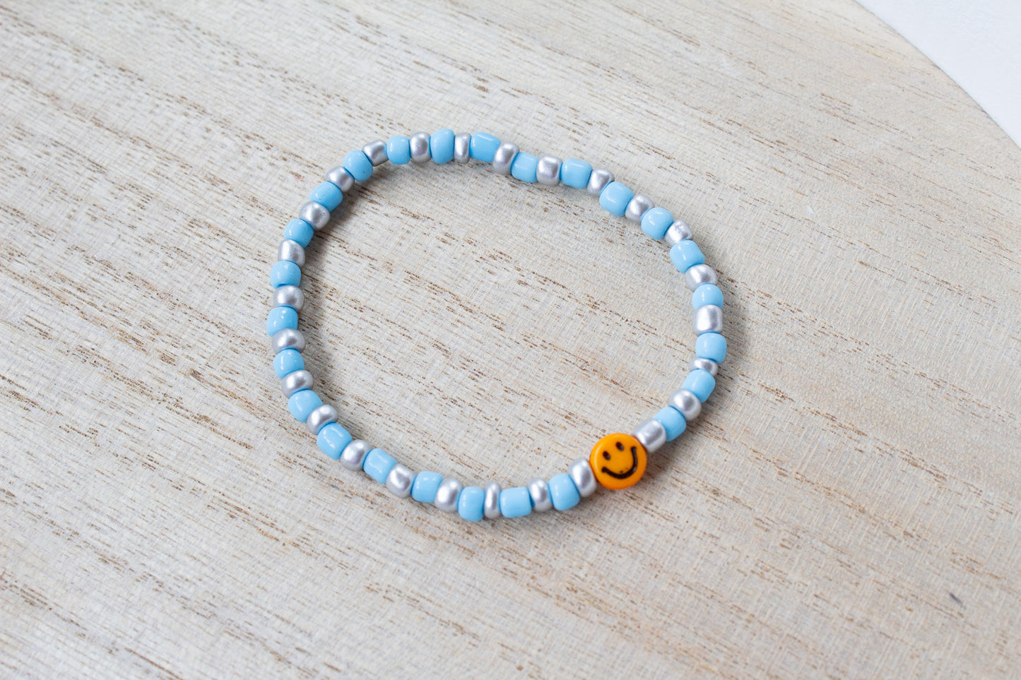 Buntes Perlenarmband Multicolor mit Smiley orange